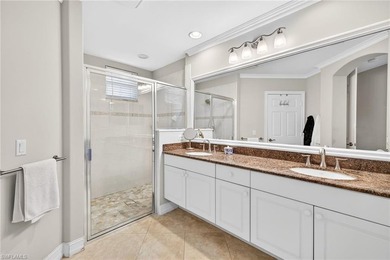 Tastefully updated first floor coach home is now available in on Pelican Sound Golf and River Club in Florida - for sale on GolfHomes.com, golf home, golf lot