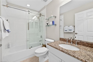 Tastefully updated first floor coach home is now available in on Pelican Sound Golf and River Club in Florida - for sale on GolfHomes.com, golf home, golf lot