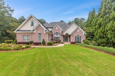 This exquisite four-sided blush brick estate is the epitome of on Royal Lakes Golf and Country Club in Georgia - for sale on GolfHomes.com, golf home, golf lot
