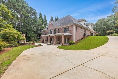 This exquisite four-sided blush brick estate is the epitome of on Royal Lakes Golf and Country Club in Georgia - for sale on GolfHomes.com, golf home, golf lot