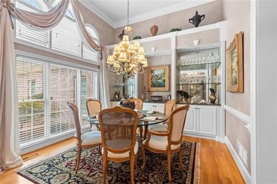 This exquisite four-sided blush brick estate is the epitome of on Royal Lakes Golf and Country Club in Georgia - for sale on GolfHomes.com, golf home, golf lot