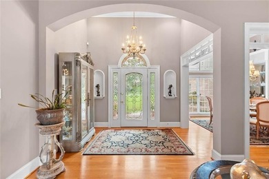 This exquisite four-sided blush brick estate is the epitome of on Royal Lakes Golf and Country Club in Georgia - for sale on GolfHomes.com, golf home, golf lot