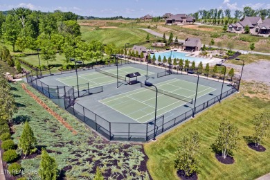 Imagine waking up to the serene beauty of a shimmering lake just on Wind River Golf Course in Tennessee - for sale on GolfHomes.com, golf home, golf lot