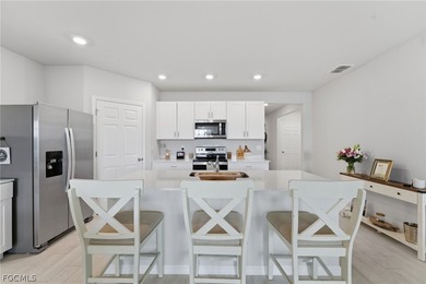 Perfectly positioned to capture tranquil LAKE and FOUNTAIN VIEWS on Herons Glen Golf and Country Club in Florida - for sale on GolfHomes.com, golf home, golf lot