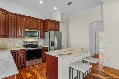 Beautiful Home in Jensen Beach Country Club situated on a on Eagle Marsh Golf Club in Florida - for sale on GolfHomes.com, golf home, golf lot
