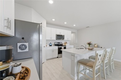 Perfectly positioned to capture tranquil LAKE and FOUNTAIN VIEWS on Herons Glen Golf and Country Club in Florida - for sale on GolfHomes.com, golf home, golf lot