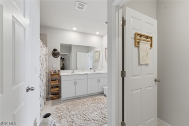 Perfectly positioned to capture tranquil LAKE and FOUNTAIN VIEWS on Herons Glen Golf and Country Club in Florida - for sale on GolfHomes.com, golf home, golf lot