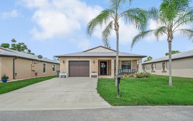 This charming home is located in the highly sought-after Spanish on Spanish Lakes I in Florida - for sale on GolfHomes.com, golf home, golf lot