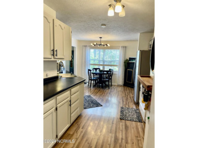 Located just 7 minutes from the world-renowned Pinehurst Resort on Pinehurst Golf Course No. 8 in North Carolina - for sale on GolfHomes.com, golf home, golf lot