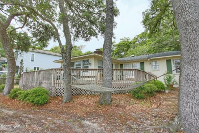 Embark on a journey to this magnificent 3 bedroom 2 bath home on Oyster Bay Golf Links in North Carolina - for sale on GolfHomes.com, golf home, golf lot