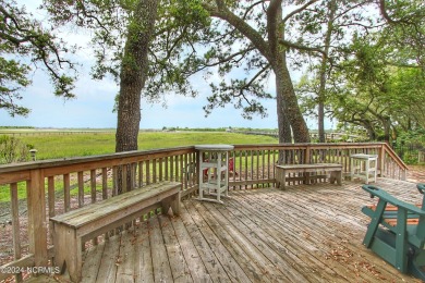 Embark on a journey to this magnificent 3 bedroom 2 bath home on Oyster Bay Golf Links in North Carolina - for sale on GolfHomes.com, golf home, golf lot