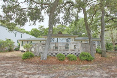 Embark on a journey to this magnificent 3 bedroom 2 bath home on Oyster Bay Golf Links in North Carolina - for sale on GolfHomes.com, golf home, golf lot