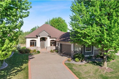 Experience the best of one-level living with peaceful lake views on TPC of the Twin Cities in Minnesota - for sale on GolfHomes.com, golf home, golf lot