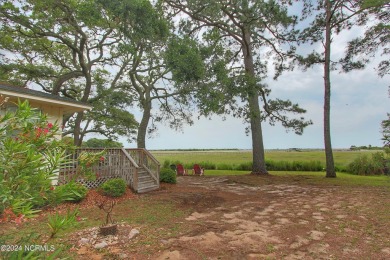 Embark on a journey to this magnificent 3 bedroom 2 bath home on Oyster Bay Golf Links in North Carolina - for sale on GolfHomes.com, golf home, golf lot