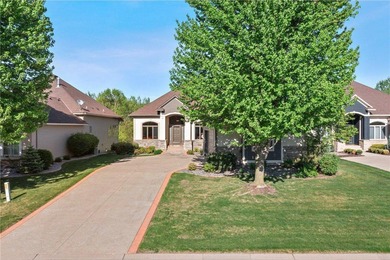 Experience the best of one-level living with peaceful lake views on TPC of the Twin Cities in Minnesota - for sale on GolfHomes.com, golf home, golf lot