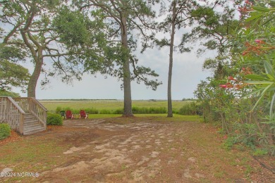 Embark on a journey to this magnificent 3 bedroom 2 bath home on Oyster Bay Golf Links in North Carolina - for sale on GolfHomes.com, golf home, golf lot