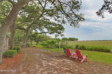 Embark on a journey to this magnificent 3 bedroom 2 bath home on Oyster Bay Golf Links in North Carolina - for sale on GolfHomes.com, golf home, golf lot