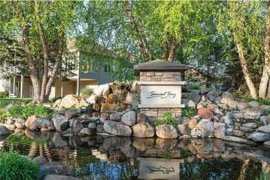 Experience the best of one-level living with peaceful lake views on TPC of the Twin Cities in Minnesota - for sale on GolfHomes.com, golf home, golf lot
