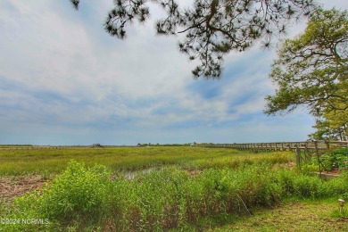 Embark on a journey to this magnificent 3 bedroom 2 bath home on Oyster Bay Golf Links in North Carolina - for sale on GolfHomes.com, golf home, golf lot