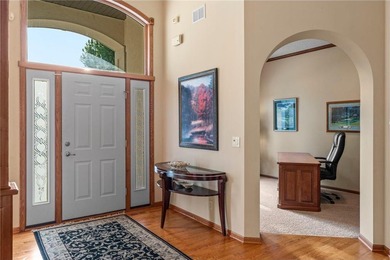 Experience the best of one-level living with peaceful lake views on TPC of the Twin Cities in Minnesota - for sale on GolfHomes.com, golf home, golf lot