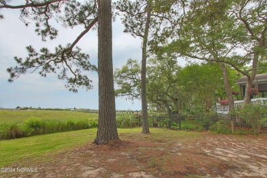 Embark on a journey to this magnificent 3 bedroom 2 bath home on Oyster Bay Golf Links in North Carolina - for sale on GolfHomes.com, golf home, golf lot