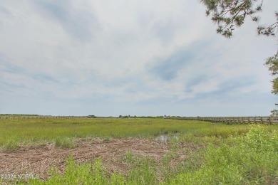 Embark on a journey to this magnificent 3 bedroom 2 bath home on Oyster Bay Golf Links in North Carolina - for sale on GolfHomes.com, golf home, golf lot