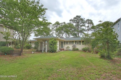 Embark on a journey to this magnificent 3 bedroom 2 bath home on Oyster Bay Golf Links in North Carolina - for sale on GolfHomes.com, golf home, golf lot