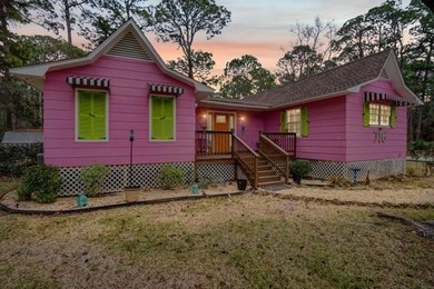 This wonderfully Eclectic Cottage is nestled next to dunes in on Isle Dauphine Club Golf Course in Alabama - for sale on GolfHomes.com, golf home, golf lot