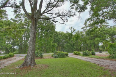 Embark on a journey to this magnificent 3 bedroom 2 bath home on Oyster Bay Golf Links in North Carolina - for sale on GolfHomes.com, golf home, golf lot