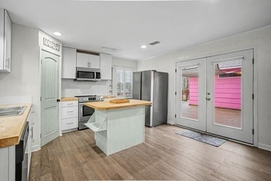 This wonderfully Eclectic Cottage is nestled next to dunes in on Isle Dauphine Club Golf Course in Alabama - for sale on GolfHomes.com, golf home, golf lot