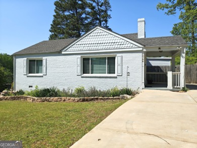 No HOA - Discover the perfect blend of contemporary elegance and on Charlie Yates Golf Course in Georgia - for sale on GolfHomes.com, golf home, golf lot