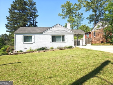 No HOA - Discover the perfect blend of contemporary elegance and on Charlie Yates Golf Course in Georgia - for sale on GolfHomes.com, golf home, golf lot
