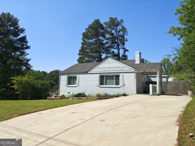 No HOA - Discover the perfect blend of contemporary elegance and on Charlie Yates Golf Course in Georgia - for sale on GolfHomes.com, golf home, golf lot