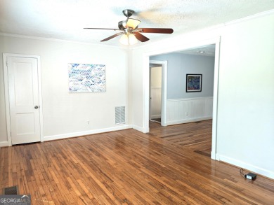 No HOA - Discover the perfect blend of contemporary elegance and on Charlie Yates Golf Course in Georgia - for sale on GolfHomes.com, golf home, golf lot
