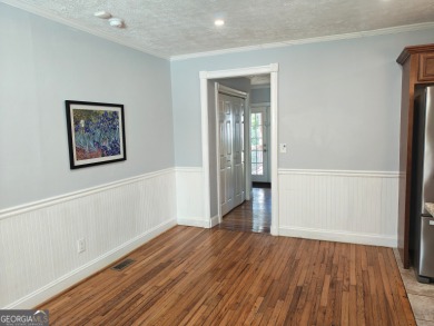 No HOA - Discover the perfect blend of contemporary elegance and on Charlie Yates Golf Course in Georgia - for sale on GolfHomes.com, golf home, golf lot