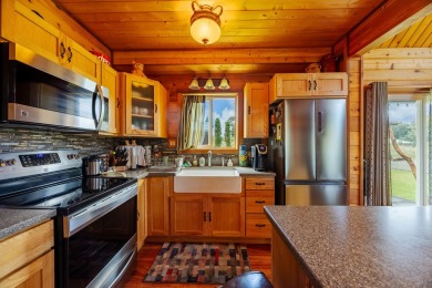 You have GOT to see this stunning cedar home nestled on the on Volcano Golf and Country Club in Hawaii - for sale on GolfHomes.com, golf home, golf lot