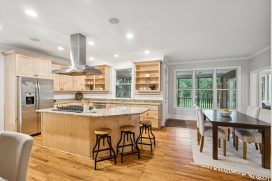 This distinguished two-story brick residence offers four on Dunes West Golf Club in South Carolina - for sale on GolfHomes.com, golf home, golf lot