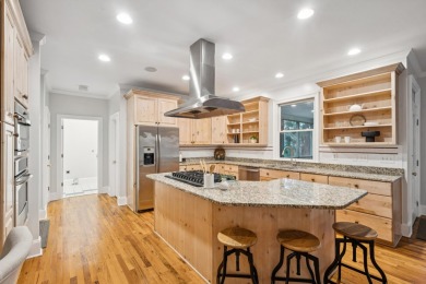 This distinguished two-story brick residence offers four on Dunes West Golf Club in South Carolina - for sale on GolfHomes.com, golf home, golf lot