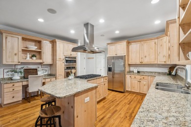 This distinguished two-story brick residence offers four on Dunes West Golf Club in South Carolina - for sale on GolfHomes.com, golf home, golf lot