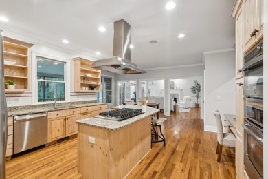 This distinguished two-story brick residence offers four on Dunes West Golf Club in South Carolina - for sale on GolfHomes.com, golf home, golf lot