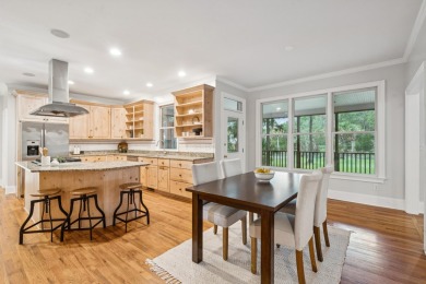This distinguished two-story brick residence offers four on Dunes West Golf Club in South Carolina - for sale on GolfHomes.com, golf home, golf lot