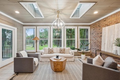 This distinguished two-story brick residence offers four on Dunes West Golf Club in South Carolina - for sale on GolfHomes.com, golf home, golf lot