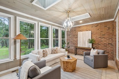This distinguished two-story brick residence offers four on Dunes West Golf Club in South Carolina - for sale on GolfHomes.com, golf home, golf lot