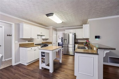 Welcome to 1130 Tributary Way in Dacula - a beautifully designed on Trophy Club of Apalachee in Georgia - for sale on GolfHomes.com, golf home, golf lot