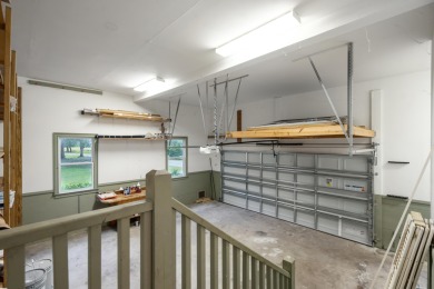 This distinguished two-story brick residence offers four on Dunes West Golf Club in South Carolina - for sale on GolfHomes.com, golf home, golf lot