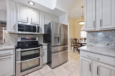 1.03 ACRES | NEWER ROOF & UPDATED MECHANICALS | LUXURY UPGRADES on Wedgefield Golf Club in Florida - for sale on GolfHomes.com, golf home, golf lot