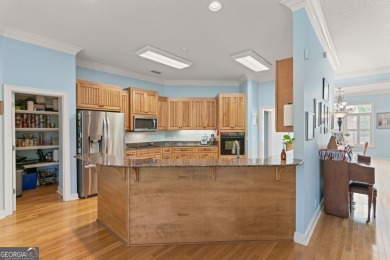 Nestled on a picturesque half-acre lot on the desirable Oak on Oak Grove Island Golf and Country Club in Georgia - for sale on GolfHomes.com, golf home, golf lot