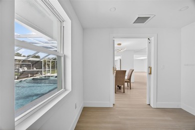 PUNTA GORDA ISLES! STUNNING MODERN 4 BEDROOM PLUS OFFICE, 3.5 on Saint Andrews South Golf Club in Florida - for sale on GolfHomes.com, golf home, golf lot