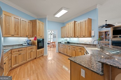 Nestled on a picturesque half-acre lot on the desirable Oak on Oak Grove Island Golf and Country Club in Georgia - for sale on GolfHomes.com, golf home, golf lot