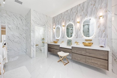 1.03 ACRES | NEWER ROOF & UPDATED MECHANICALS | LUXURY UPGRADES on Wedgefield Golf Club in Florida - for sale on GolfHomes.com, golf home, golf lot